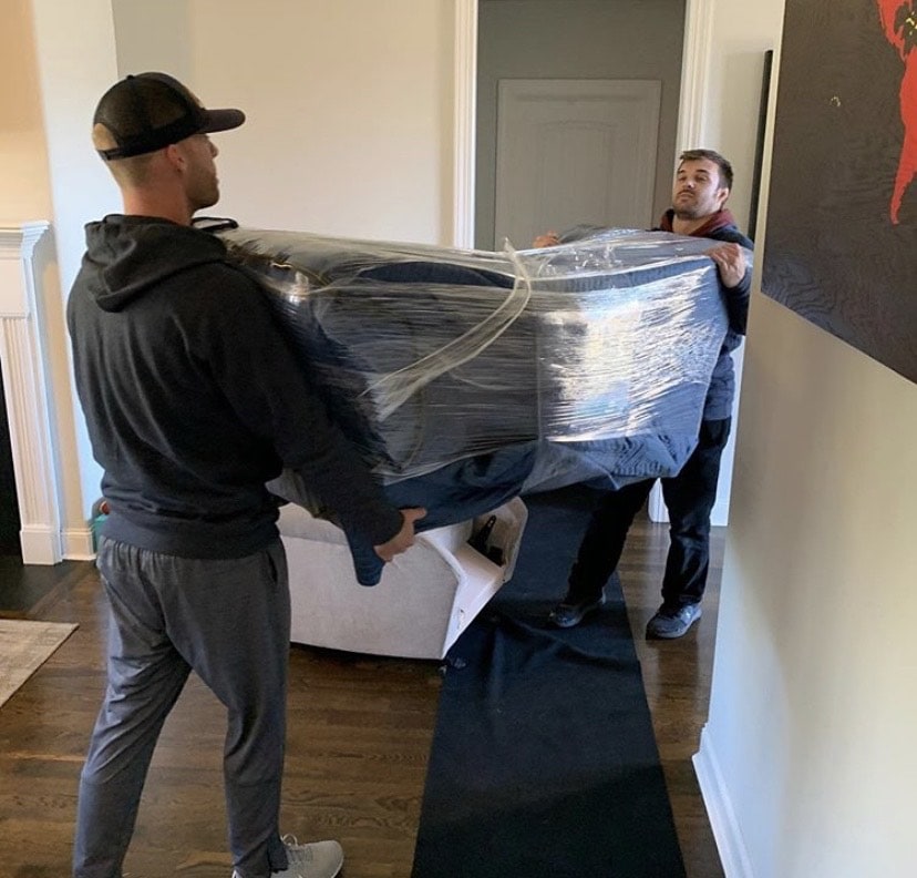 Tri-Star Moving carrying out furniture during move