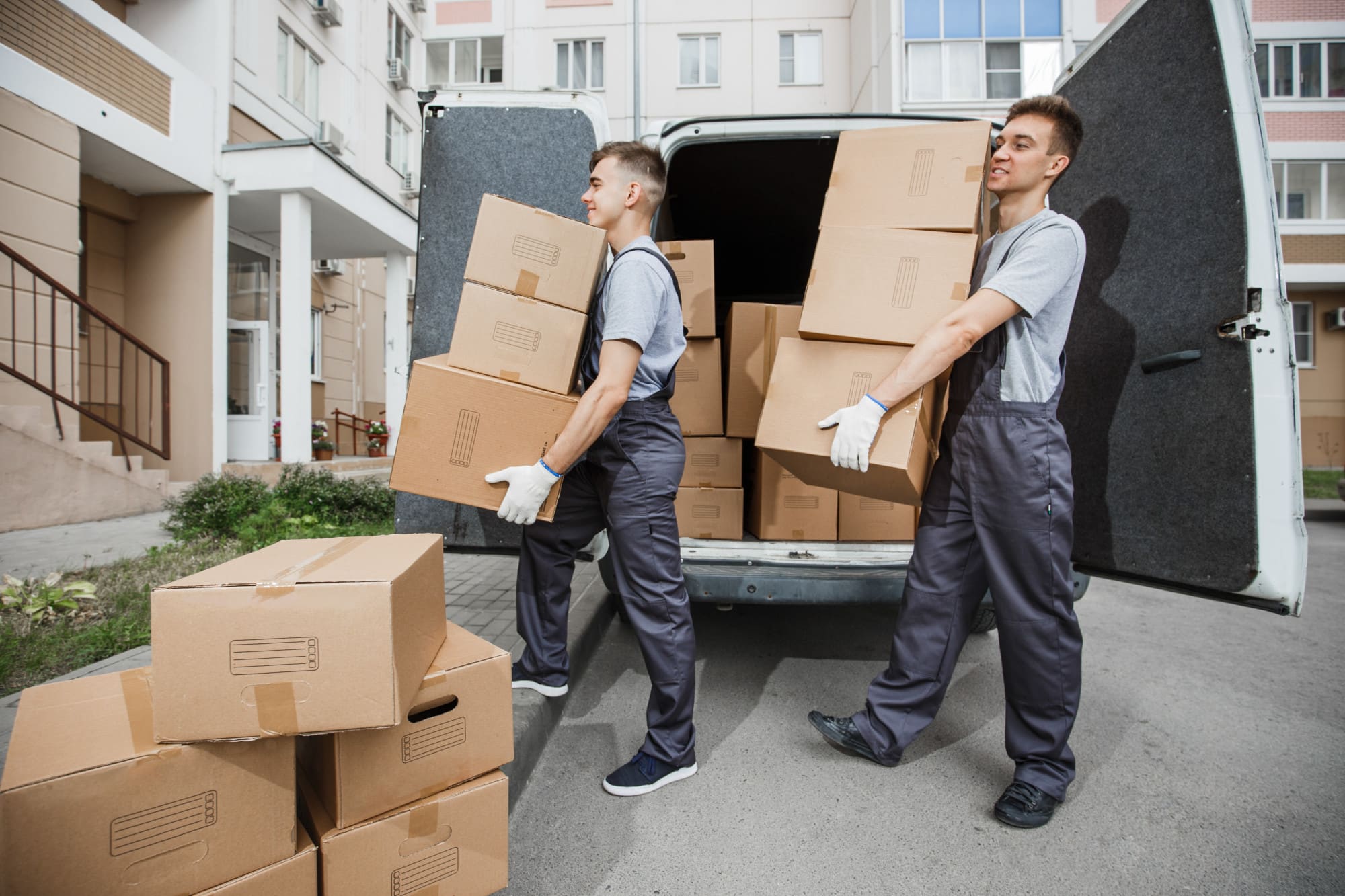 Professional movers unloading truck