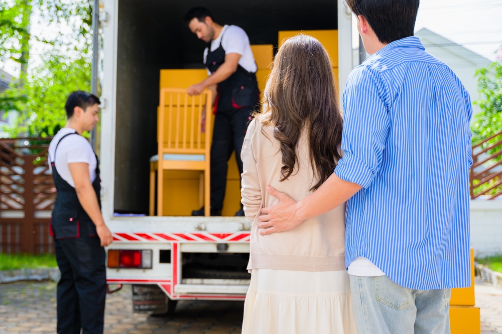 couple moving with team of movers